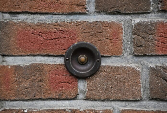 doorbell on a brick wall